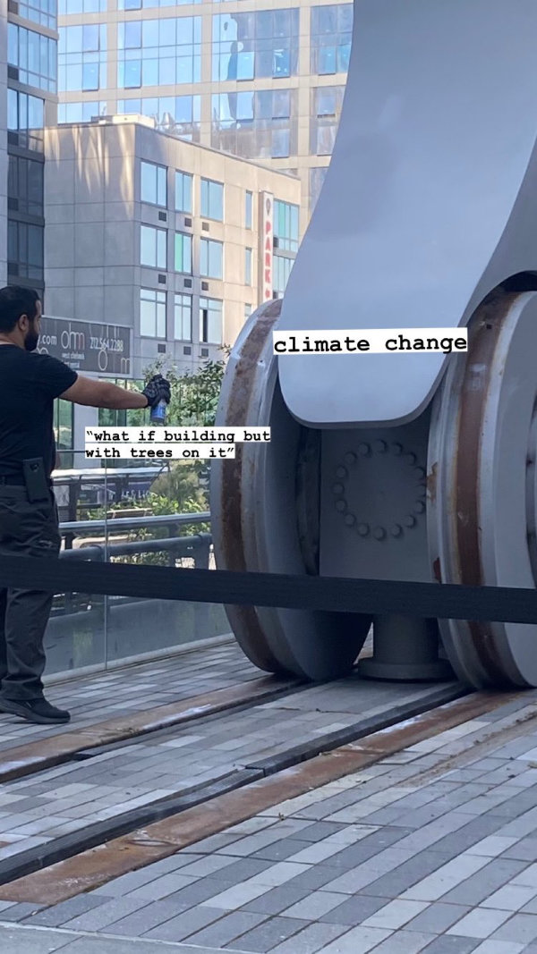 Captioned image of a person spraying WD-40 on a giant mechanism. Caption: (mechanism) Climate Change. (WD-40) What if buildings but with trees on them.