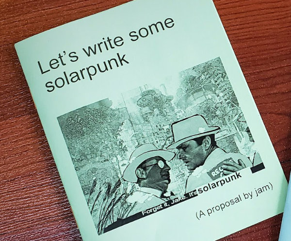 A photo of the small quarter-size green zine that jam printed in 2021.